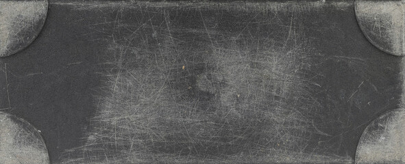 Scratched plastic surface with rough texture, seen up close