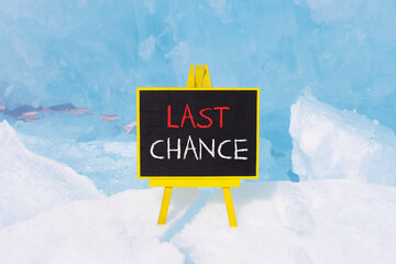 Last chance symbol. Concept word Last chance on beautiful black blackboard. Beautiful blue Baikal...