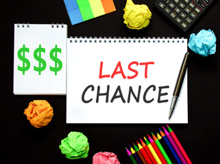 Last chance symbol. Concept word Last chance on beautiful white note. Black calculator. Black pen....