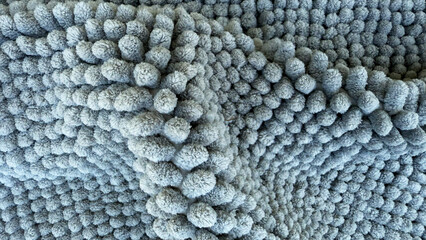 Soft textile texture with blue fluffy fabric surface, abstract background of cozy textile material with round bubble pattern