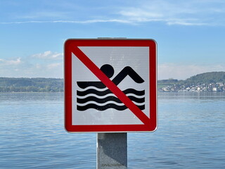 Swimming Prohibited Sign on Lake Constance (Bodensee) near Ferry Pier in Southern Germany