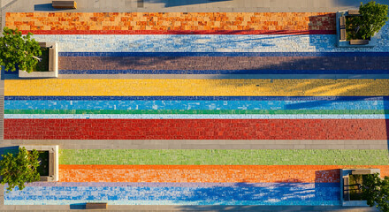 Aerial view of colorful mosaic pavement with trees and seating areas