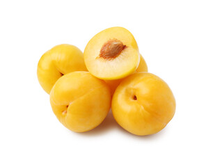 Whole and cut yellow cherry plums isolated on white