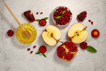 Rosh Hashanah, the Jewish New Year. Traditional symbols are apples, pomegranate and honey on a...