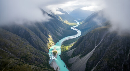 Aerial view of a turquoise river flowing through a mountain valley