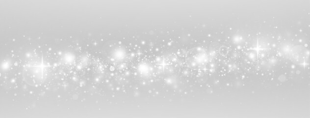 Festive particles and bokeh with glowing stardust. Glittering confetti and abstract light in a bright holiday scene.