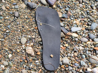 Shoe sole on a pebble background