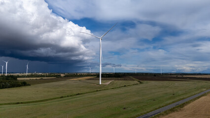 Wind turbine against dramatic stormy sky