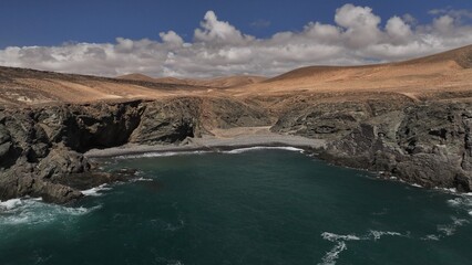 the ocean hitting the cliffs