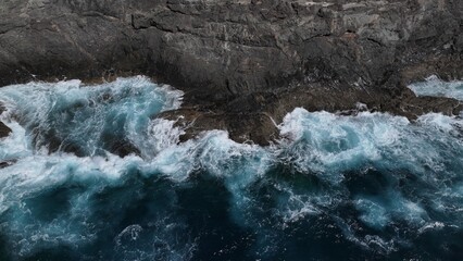 the ocean hitting the cliffs