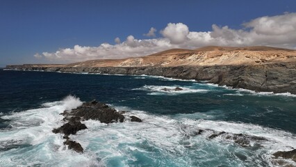 the ocean hitting the cliffs