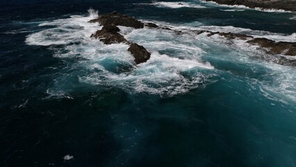 the ocean hitting the cliffs