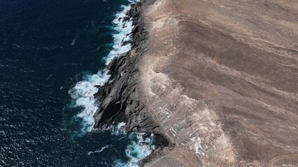 the ocean hitting the cliffs