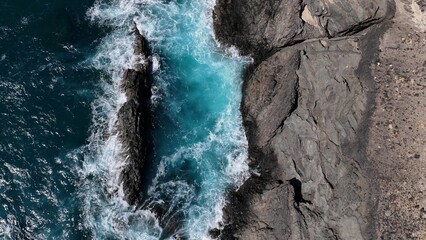 the ocean hitting the cliffs