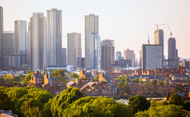 Canary Wharf, financial and business downtown in London at sunset,  view from the Greenwich hill.