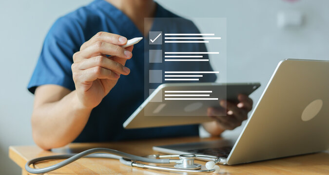 close up young general practitioner hand use stylus pen to check box on medical chekclist or opd record to read and diagnose and assess about patient's symptom for healthy and lifestyle concept