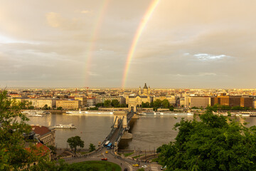 The Sz&eacute;chenyi Chain Bridge in Budapest over the Danube river with rainbow at sunset, horizontal picture