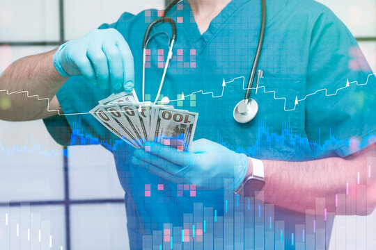 Doctor in blue scrubs and gloves holds hundred-dollar bills, with a dynamic financial graph and chart. Concept financial of the healthcare industry, including costs and medical finance. - Powered by Adobe