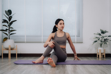 Woman Practicing Seated Spinal Twist Yoga Pose