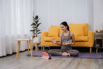 Woman Enjoying Healthy Eating and Online Fitness at Home