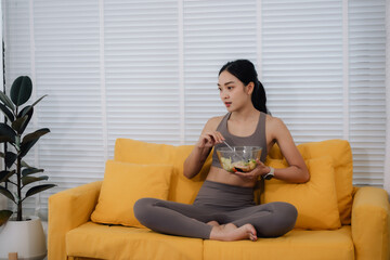 Woman Eating Healthy Salad on Sofa