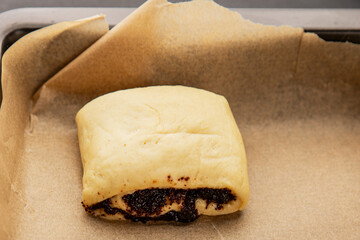Raw poppy seed buns raw pastry dough baking sweet dessert tasty snack fresh delicious gourmet food background on the table rustic top view copy space