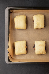 Raw poppy seed buns raw pastry dough baking sweet dessert tasty snack fresh delicious gourmet food background on the table rustic top view copy space