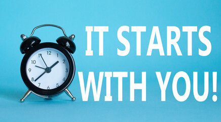 It starts with you symbol. Beautiful blue background with alarm clock. Business and It starts with...