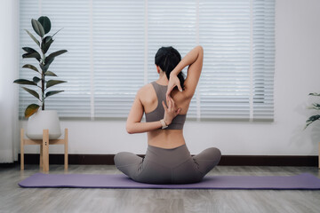 Woman Stretching Back in Yoga Pose at Home