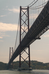 Obraz premium 25 de Abril Bridge Lisbon, Portugal, railway road suspension bridge, engineering huge structure