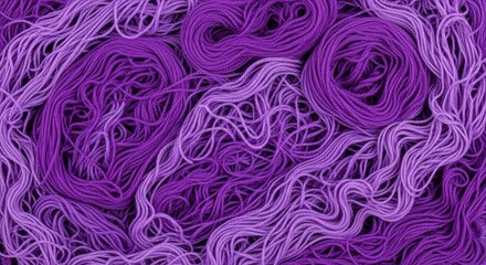 Fototapeta premium Twisted, swirling, messy pile of purple yarn, background pattern