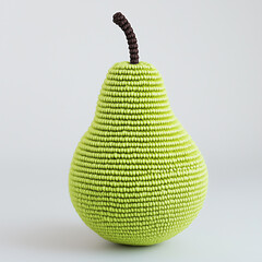 A crocheted green pear with a brown stem against a neutral background. 