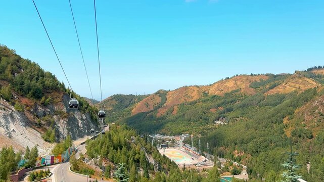 View of the Medeo high-mountain sports complex and cable cars in Almaty, Kazakhstan