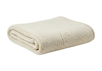 A folded, neutral-toned knitted throw blanket, featuring a simple rib stitch pattern, displayed against a black background.