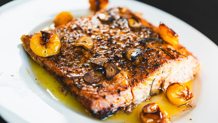 Succulent pan-seared salmon drizzled with olive oil, topped with crispy burnt garlic slices and...