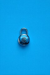 Silver Padlock on Bright Blue Background