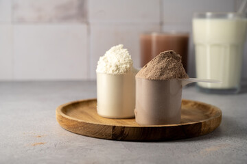 Protein powder and protein drinks, with scoops. Food supplement, bodybuilding, fitness and sport