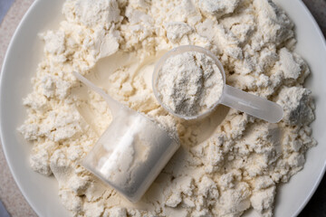 Protein whey powder with scoops. Food supplement, bodybuilding, fitness and gym lifestyle. 