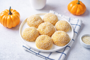 Pumpkin sesame seeds balls in a plate with tea