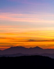 Sunset over mountains. Soft, blurry colors