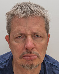 middle-aged man showing sadness and disappointment. Useful in illustrating emotional states, psychological conditions, human reaction themes, and editorial or educational content 