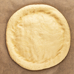 Raw pizza dough making pizza base tasty snack fresh delicious gourmet food background on the table...