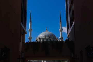 Nursetiye Mosque 1823 framed by Galataport walls in Karakoy Istanbul
