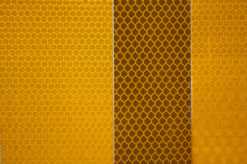 Yellow and Amber Reflective Safety Tape Patterns Close-Up