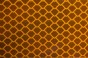 Yellow and Amber Reflective Safety Tape Patterns Close-Up