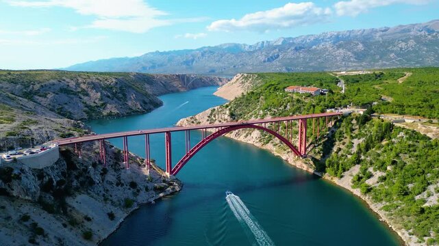 Aerial view of Maslenički Bridge (Maslenica Bridge) spanning the Novsko Ždrilo strait near the Velebit mountains in Croatia. A famous spot for rope jumping and extreme sports