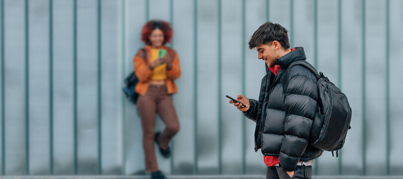 student with backpack and mobile phone back to school - Powered by Adobe