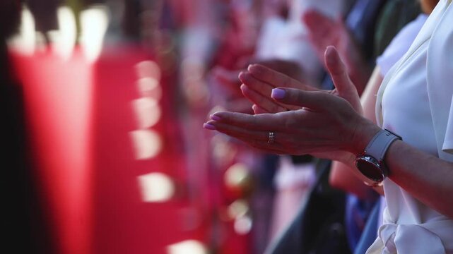 Actors, celebrities and stars on red carpet, guests and fans cheer an clapping hands, welcome, applause and ovation on cinema movie premiere, film festival award ceremony, ropes and golden barriers