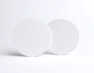 Two blank white circles on a light background