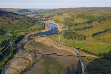 Naklejka premium Aerial View of Dried Landscape Surrounding a Reservoir in the Countryside